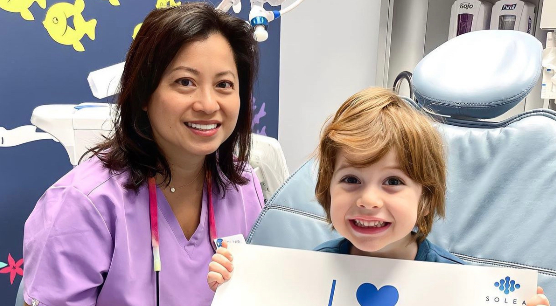 Pediatric laser dentist and her patient smile after using the Solea laser in Clarendon Hills, IL.