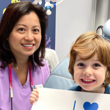 Pediatric laser dentist and her patient smile after using the Solea laser in Clarendon Hills, IL.
