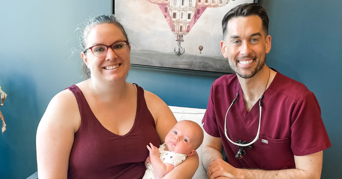 Our pediatric laser dentist poses with his tongue tie patient after a successful release.
